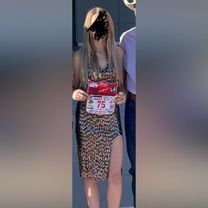 Gold and Black prom dress. Short, sequined with a slit. Worn once!